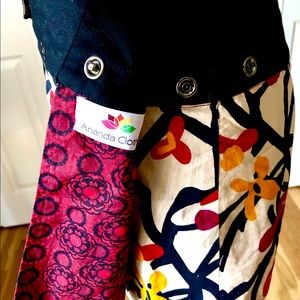 Designer Reversible Mini Skirt with snap closure.